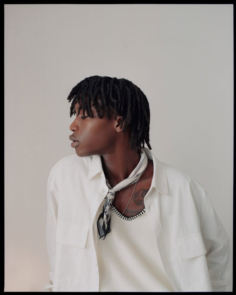 Stylish man in ZARA fashion, NYC 2021, showcasing modern men's clothing.