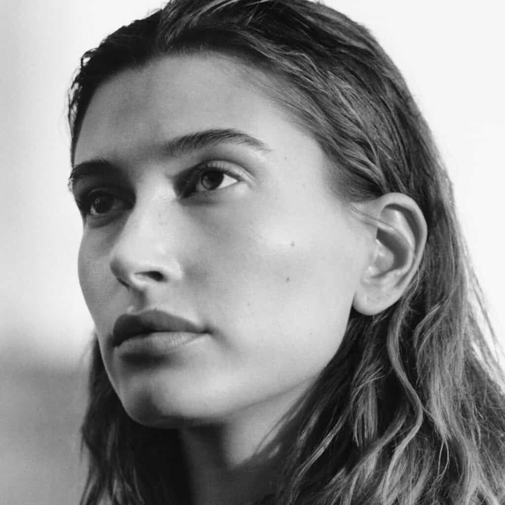 Black and white portrait of Hailey Bieber for Perfect Magazine feature.