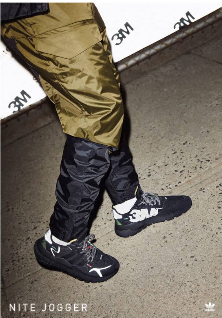 Adidas Nite Jogger sneakers in black and white with reflective details.