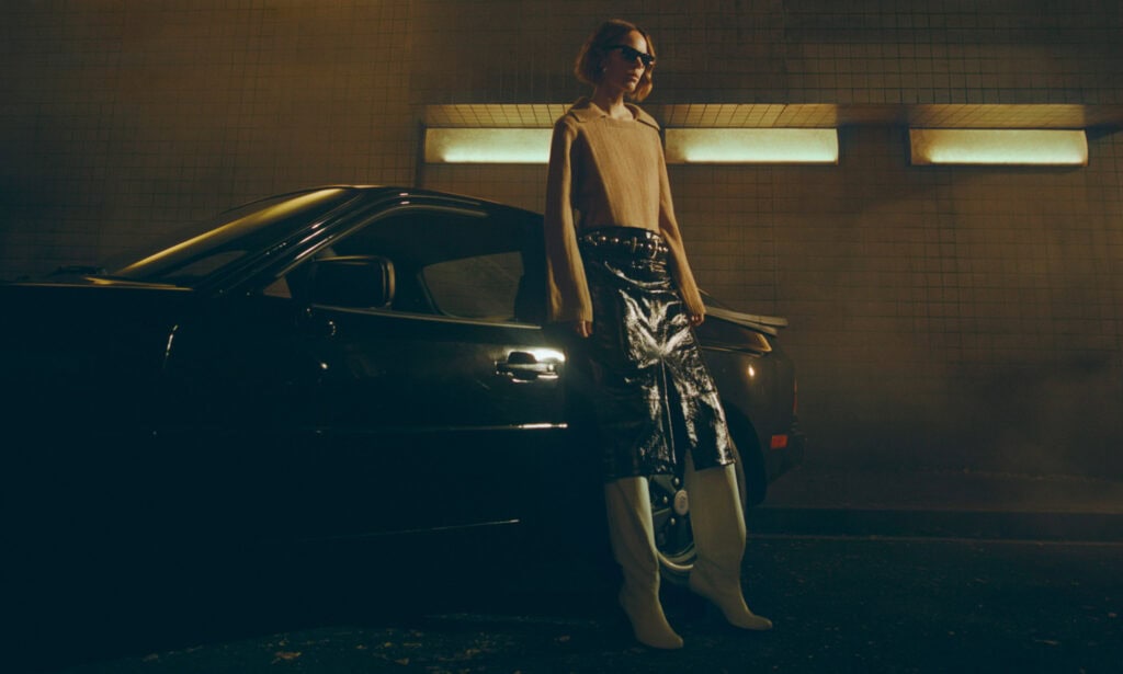 Freja 2022 by KHAITE in NYC, featuring a stylish woman in a leather skirt and sunglasses.