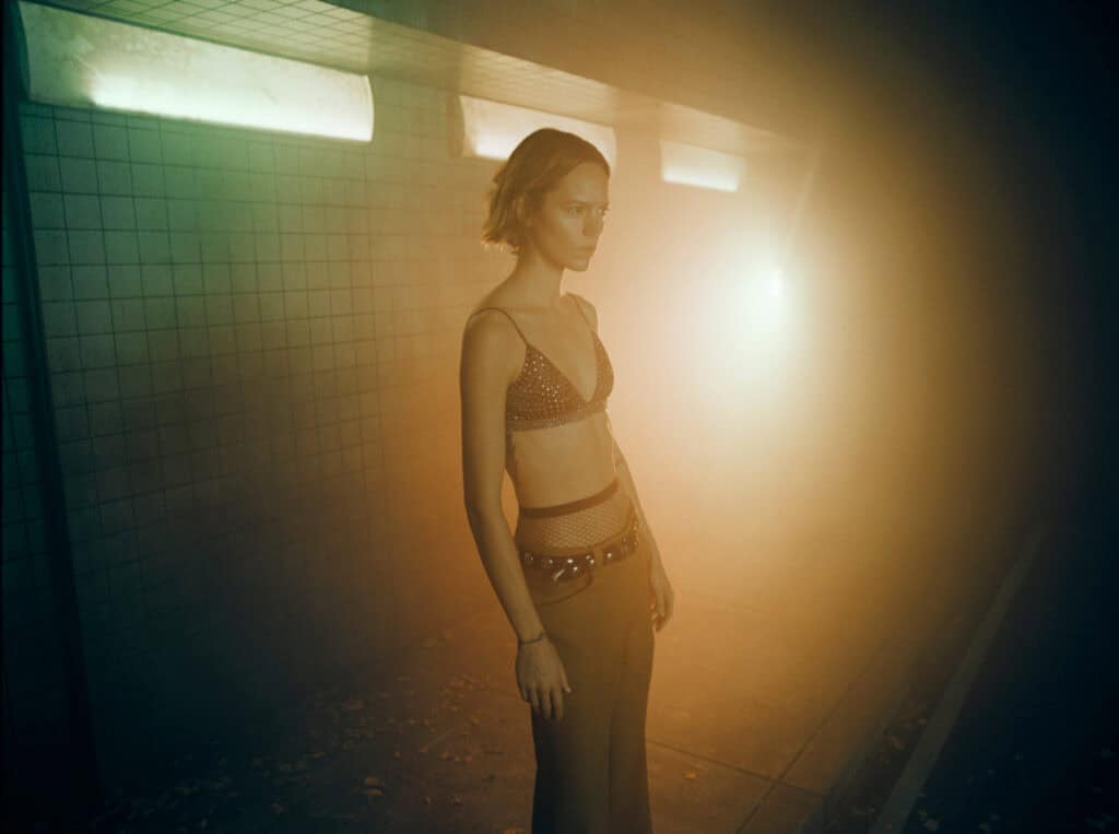 Elegant model in edgy fashion shot for KHAITE Freja 2022 collection.