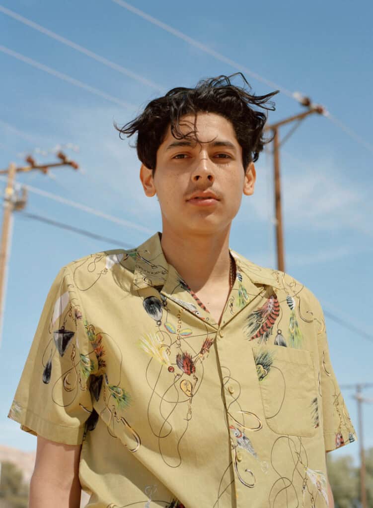 Urban Outfitter desert fashion photoshoot with a young male model outdoors.