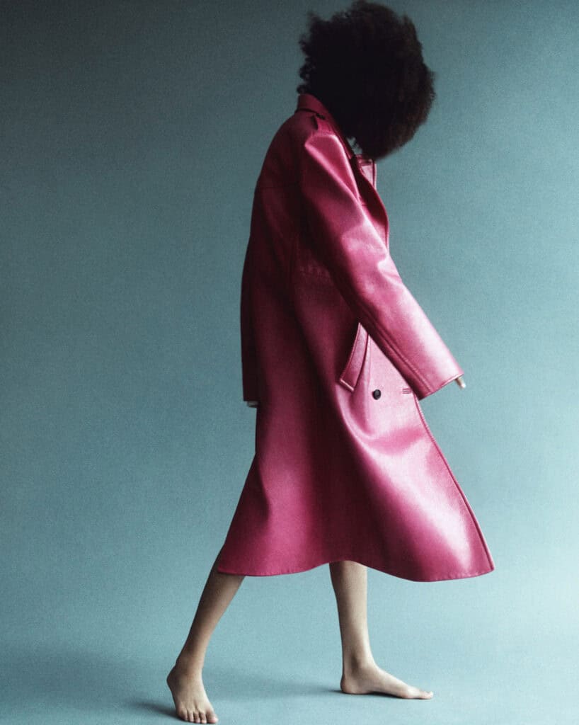Selena Forrest modeling a stylish pink satin coat for Self Service N°57 by Block Productions.