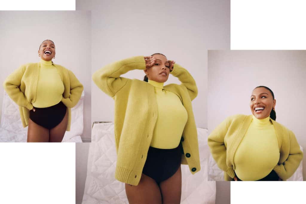 Confident woman in yellow sweater and black shorts for Porter Magazine.