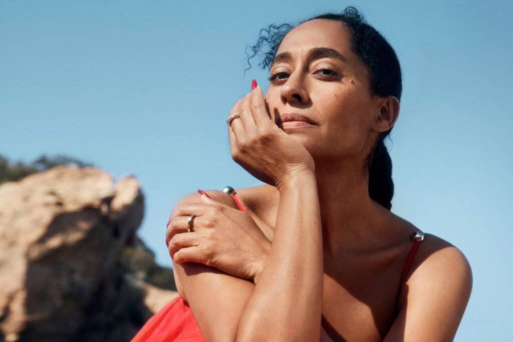 Tracee Ellis Ross posing outdoors for Porter Magazine.