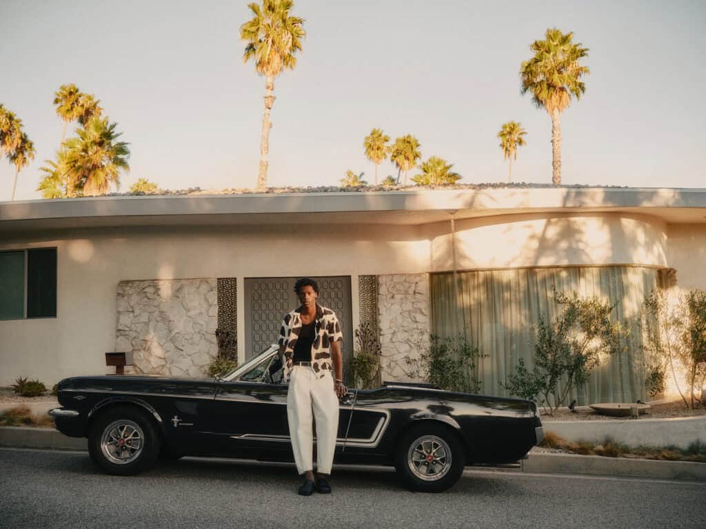 Stylish man in ZARA outfit with classic car in Los Angeles, 2022.