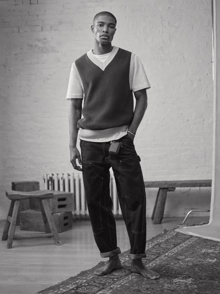 Young man wearing Zara fashion in a minimalist NYC studio setting.