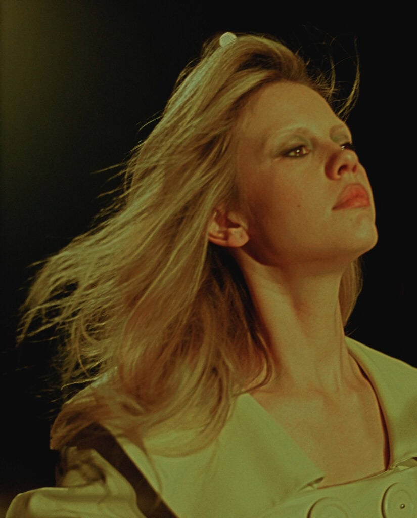 A woman with flowing blonde hair and a confident expression, captured in a fashion editorial for Cul.